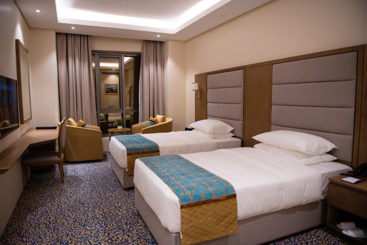 Rozana Hotel Muskat Bagian luar foto